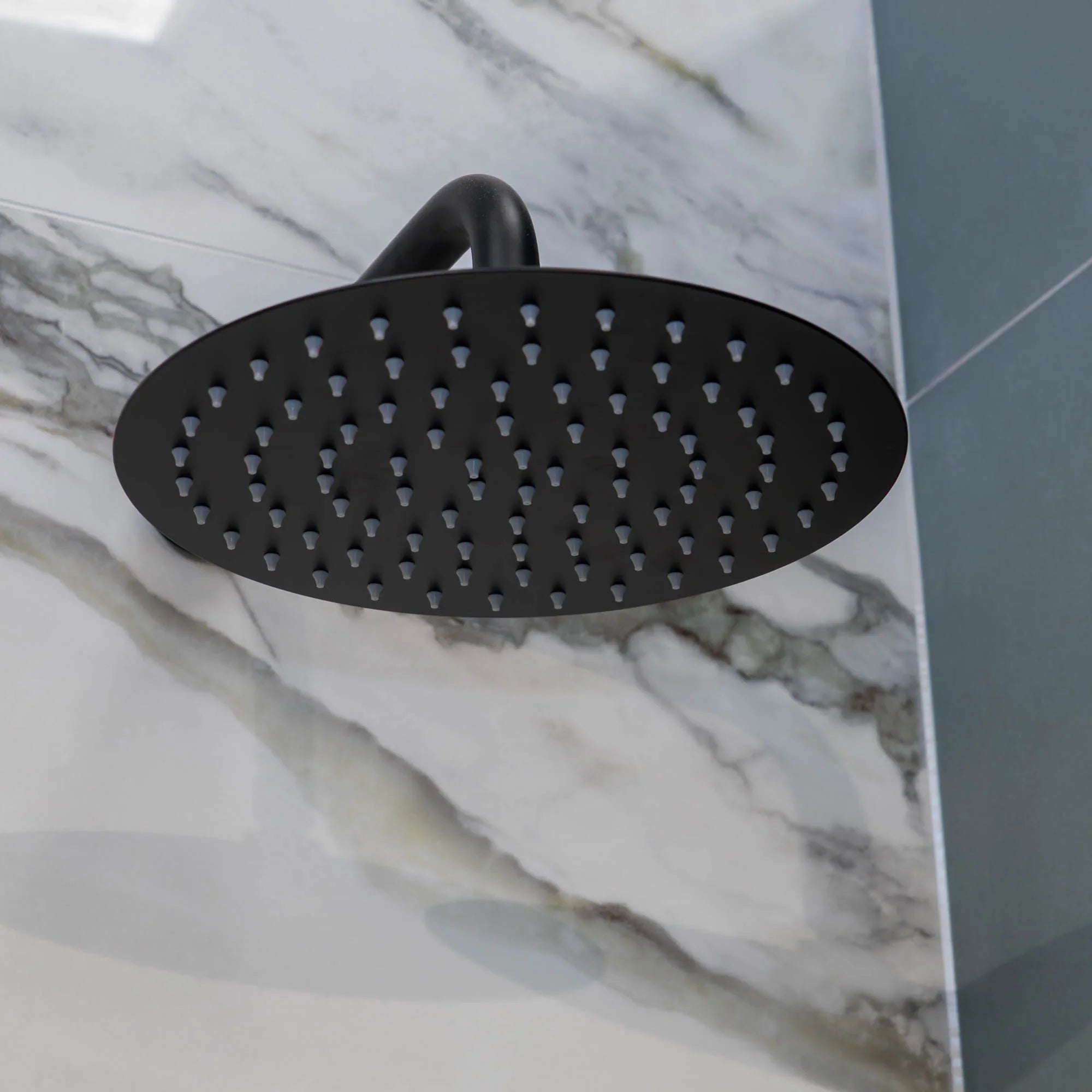 Portofino black shower head on a marble wall deluxe bathrooms