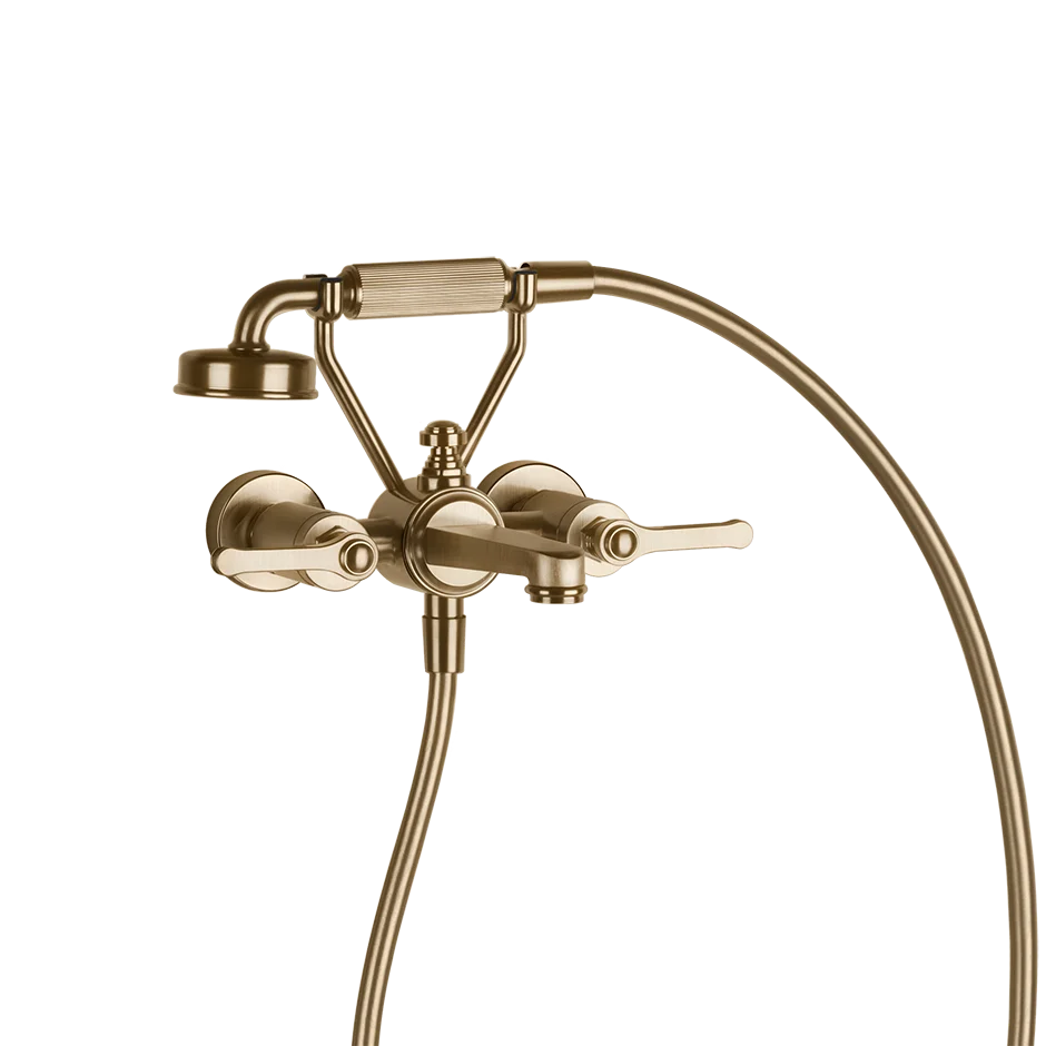 Gessi  Venti20 wall-mounted shower in the warm bronze brushed finish, with a flexible hose, adjustable shower head, and 2 lever handles.