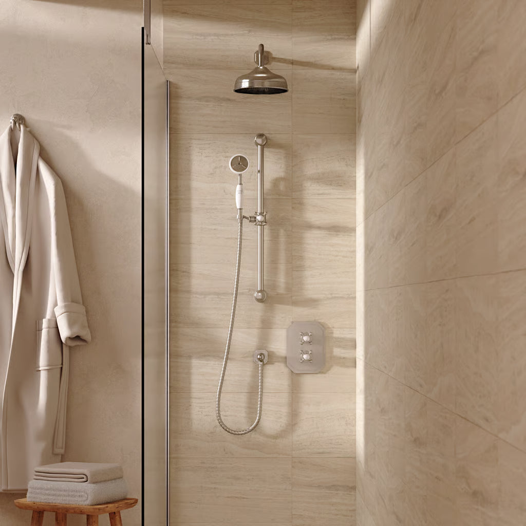 Lifestyle image of the Belgravia Shower Set Bundle in brushed nickel, featuring wall mounted shower head and slide rail for the handset. Supplied by Deluxe Bathrooms Ireland.