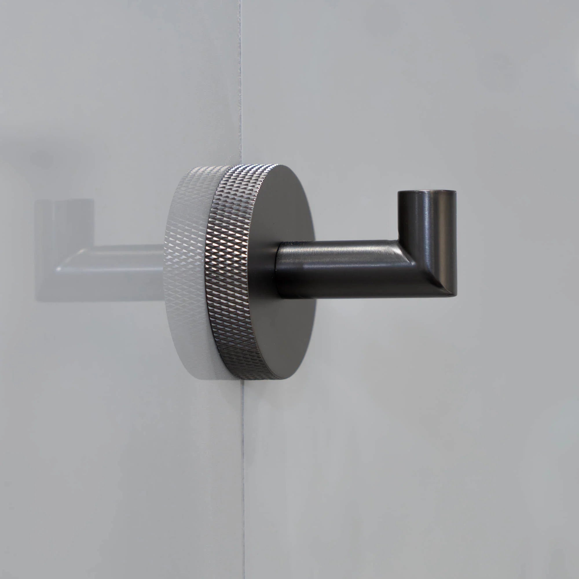 Gunmetal portofino knurled robe hook on a textured wall deluxe bathrooms