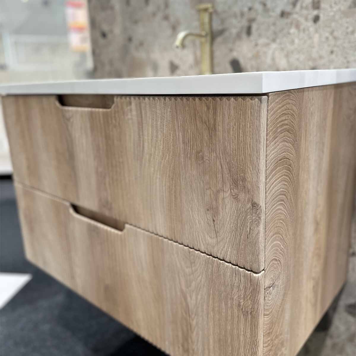 https://deluxebathrooms.co.uk/cdn/shop/products/Granlusso-Opus-Oak-Fluted-Wall-Mounted-Vanity-Unit-With-White-Solid-Surface-Washbasin-2-Deluxe-Bathrooms.jpg?v=1691657837&width=1200